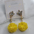 Earring with pompom yellow